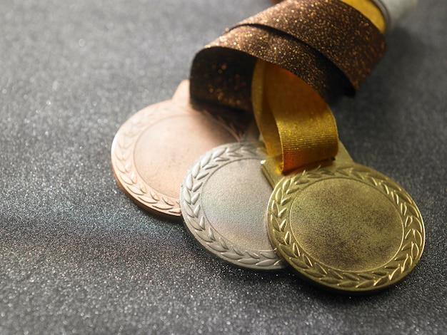 High angle view of medals over abstract background