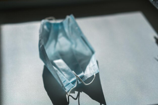 high angle view of medical mask on table