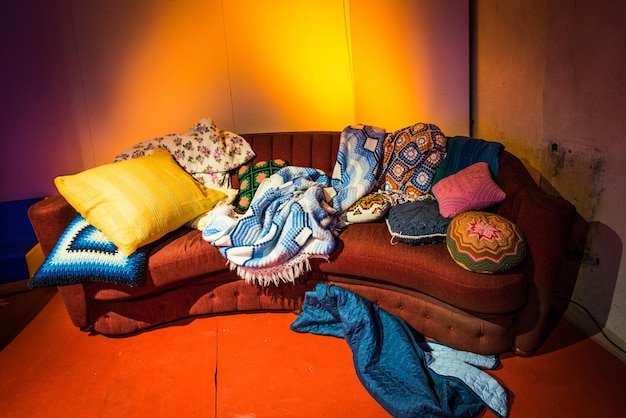 high angle view of messy sofa at home
