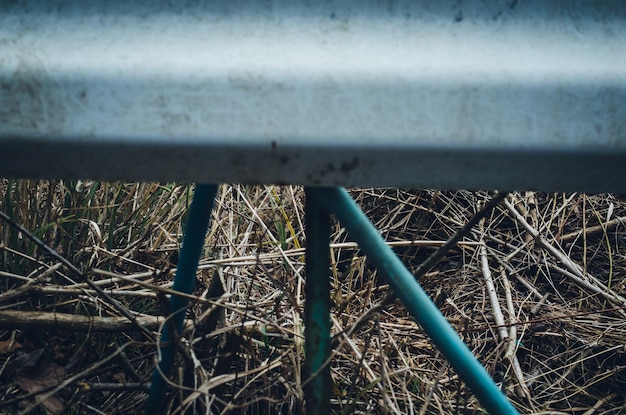 High angle view of metal railing on field