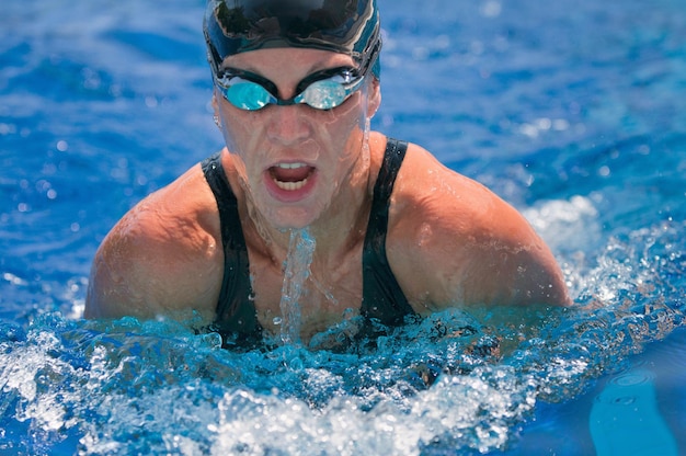 high angle view of mid adult woman swimming in pool