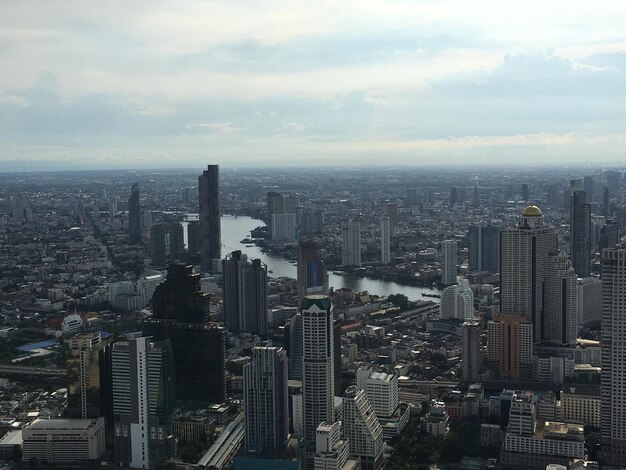 High angle view of modern buildings in city against sky