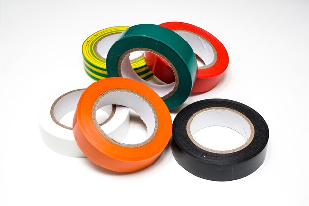 High angle view of multi colored adhesive tapes on gray background