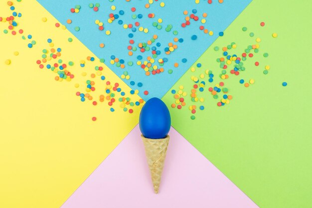 High angle view of multi colored balloons on blue table