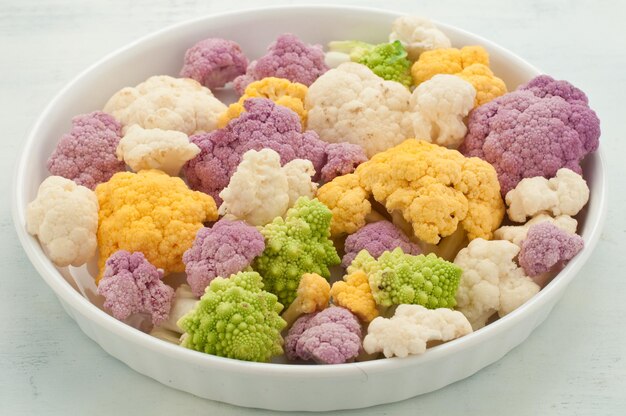 High angle view of multi colored candies in bowl on table