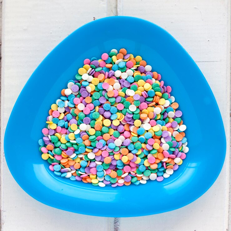 Photo high angle view of multi colored candies in bowl