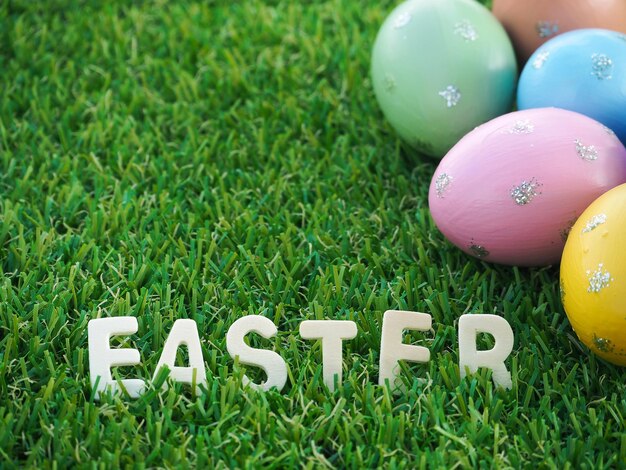 Photo high angle view of multi colored eggs on grass