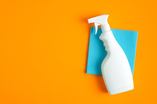 high angle view of multi colored paper against orange background