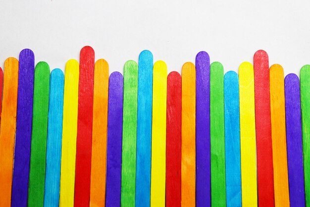 High angle view of multi colored pencils against white background