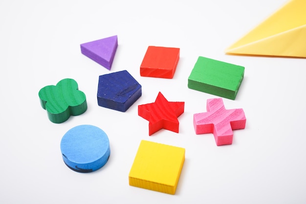 Photo high angle view of multi colored toy blocks arranged on white background