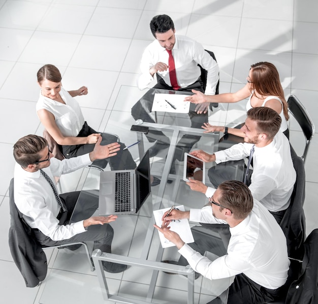 High angle view of multiethnic business people discussing in board room meeting