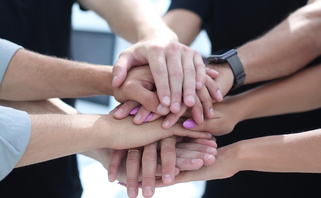 High angle view of multiracial businesspeople stacking hands over each other