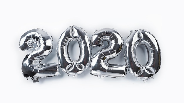 High angle view of number balloons over white background