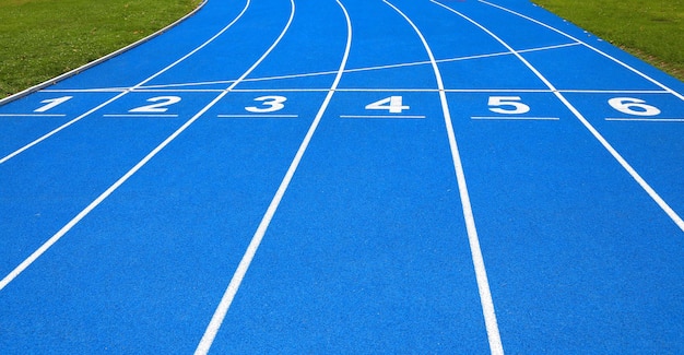 High angle view of numbers on blue running track