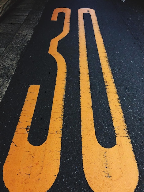 High angle view of numbers on road in city