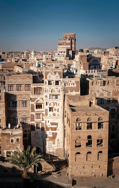 High angle view of old buildings against clear sky in city