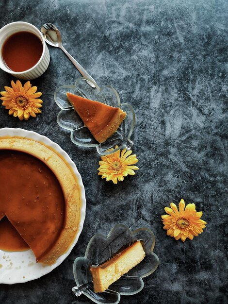 High angle view of orange rose on table