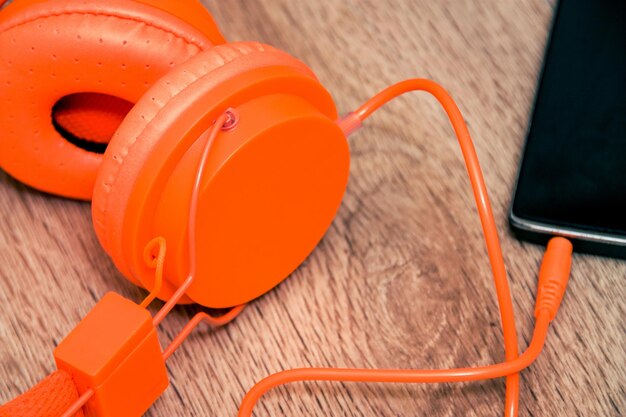 High angle view of orange telephone on table