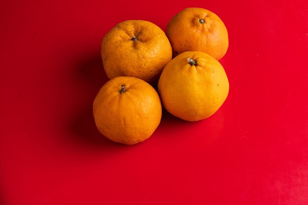 High angle view of oranges against red background