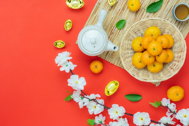 High angle view of oranges in basket by ingots on table