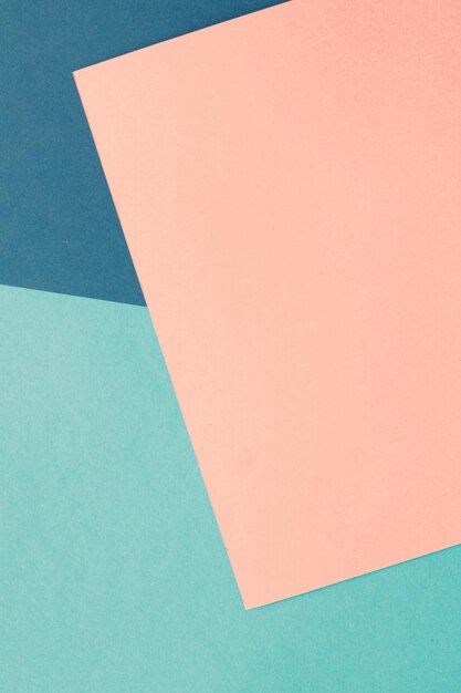 High angle view of paper on blue background