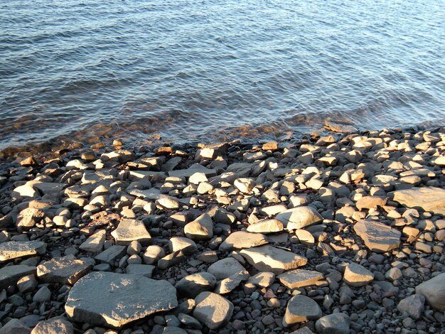 High angle view of pebbles on beach