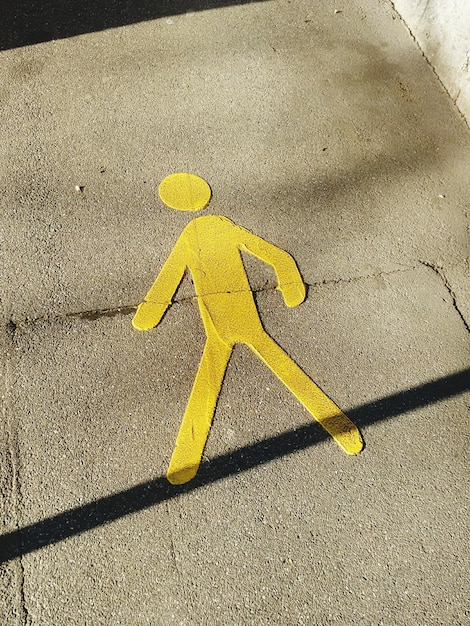 High angle view of pedestrian sign on street