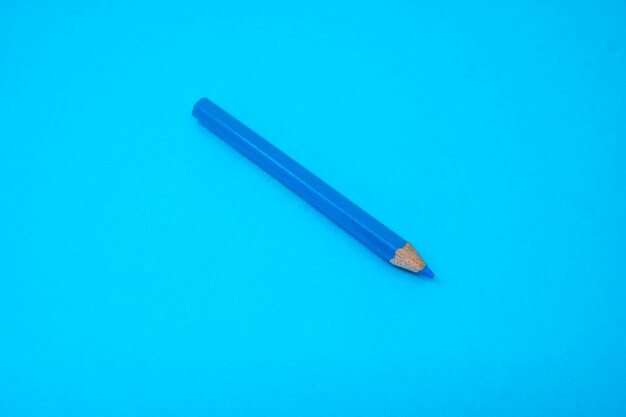 High angle view of pen on blue table