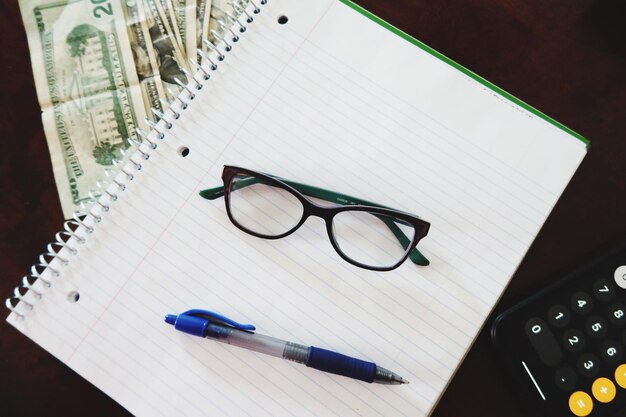 High angle view of pen and book on table