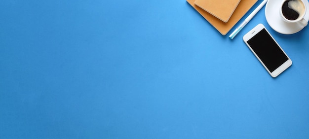 High angle view of pen on table against blue background