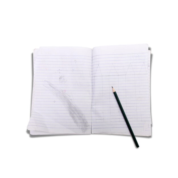 High angle view of pencil on book over white background