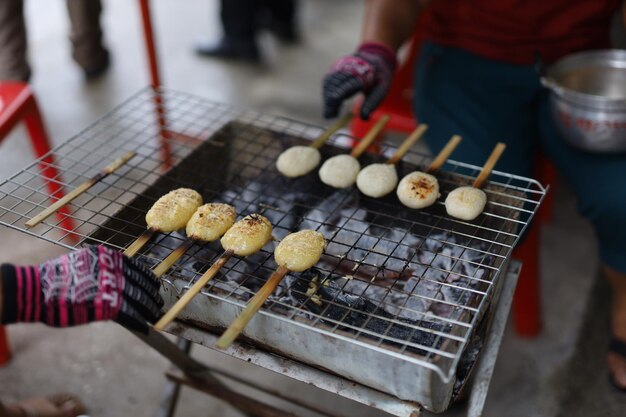 High angle view of people on barbecue grill