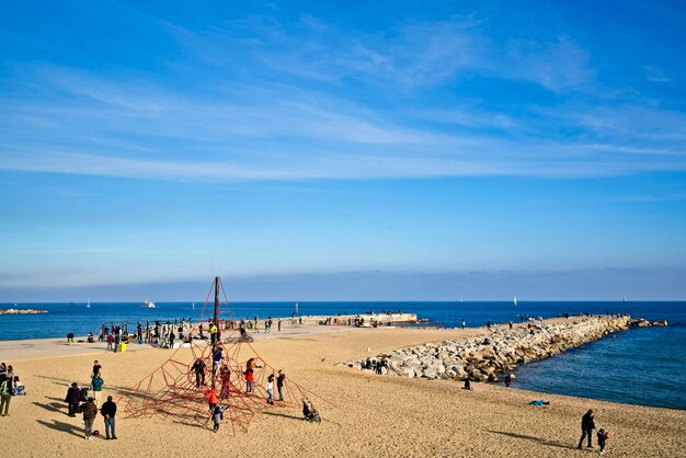 High angle view of people at beach against sky