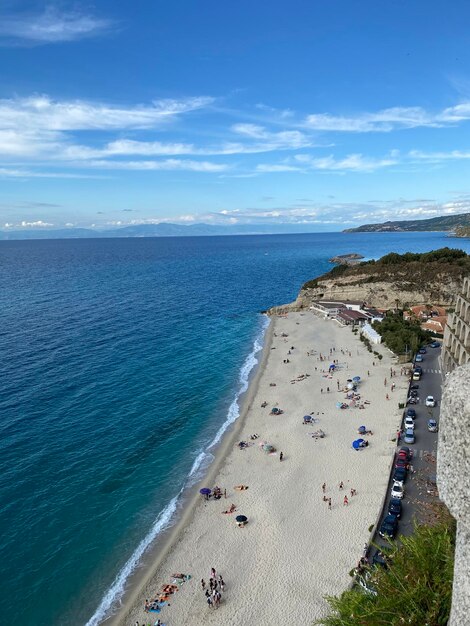 High angle view of people on beach against sky