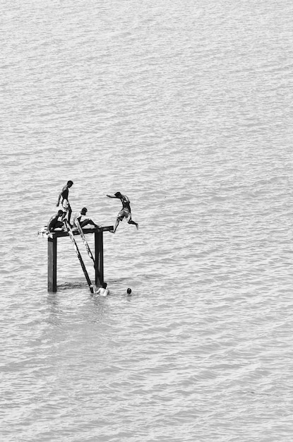 High angle view of people on diving platform in river