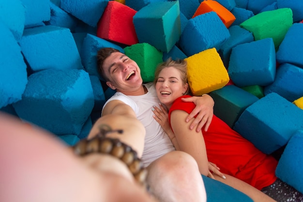 High angle view of people relaxing on bed