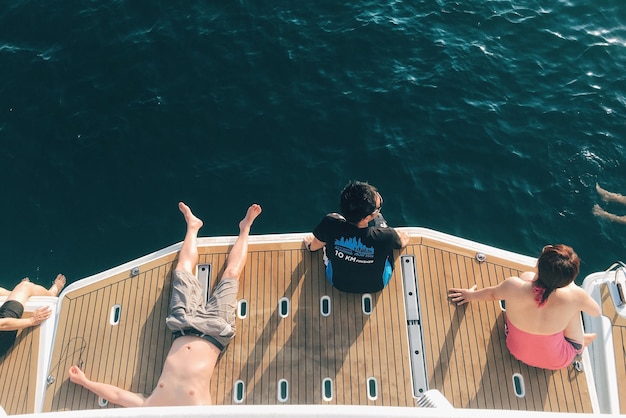 high angle view of people sitting on jetty