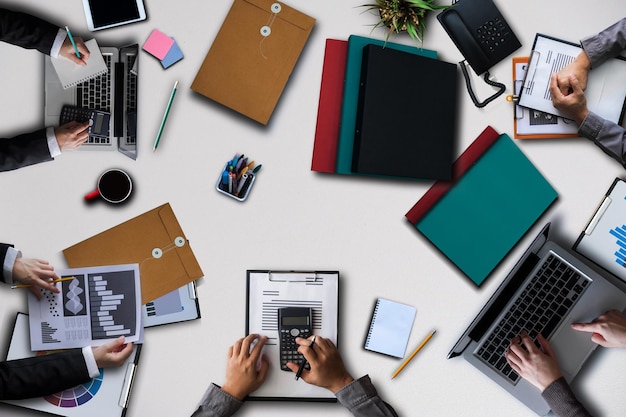 high angle view of people using laptop on table