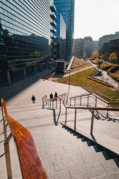 high angle view of people walking by staircase in city