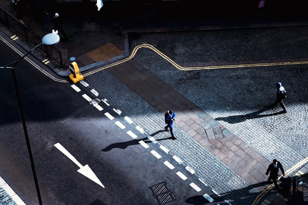 High angle view of people walking on city street