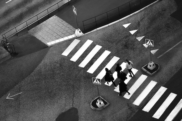 High angle view of people walking on zebra crossing