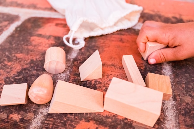 Photo high angle view of person holding toy on table