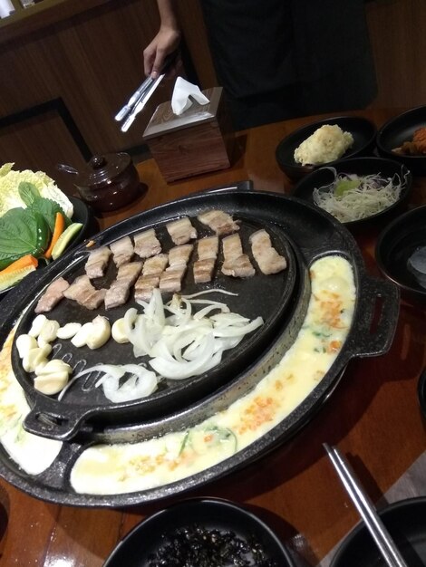 High angle view of person preparing food on table