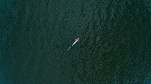 Photo high angle view of person on rowboat in sea