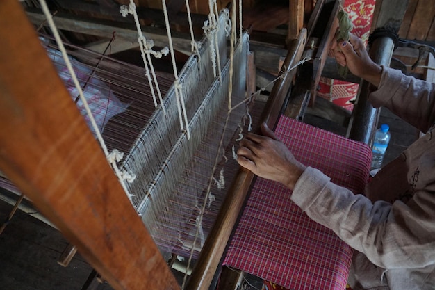 Photo high angle view of person working on handloom