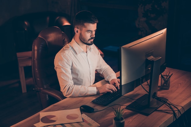 High angle view photo of pensive thoughtful man use pc