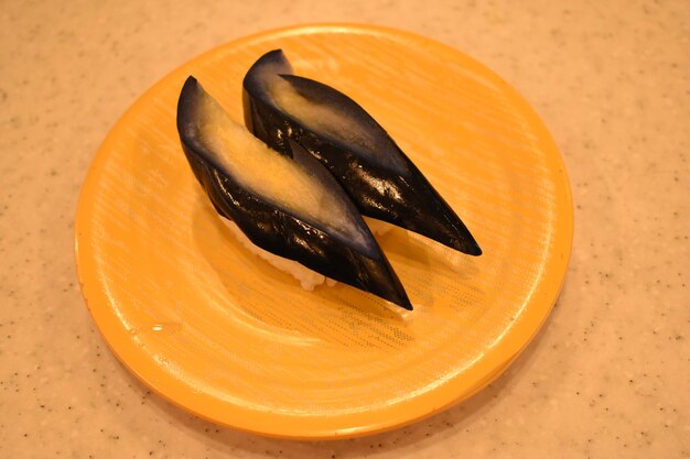 High angle view of pickled eggplant sushi in plate on table