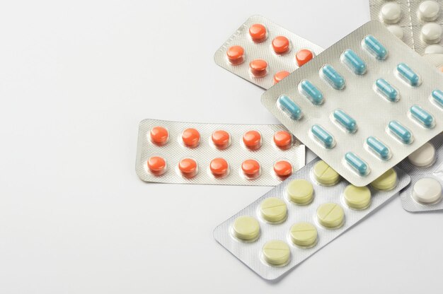 high angle view of pills on white background