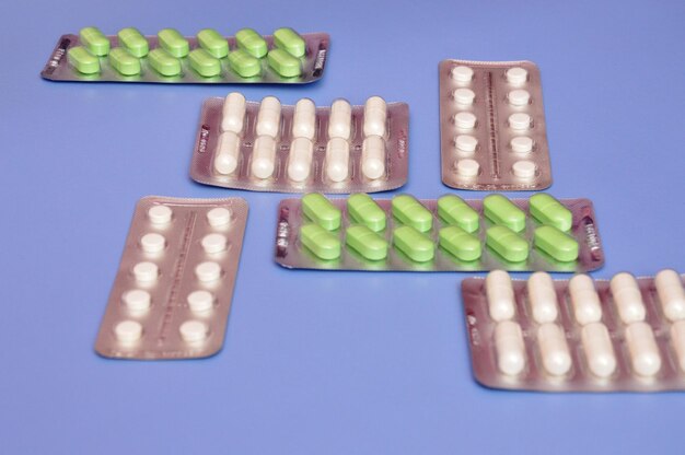 High angle view of pills on white background