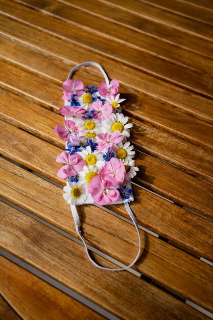 High angle view of pink flower on wood